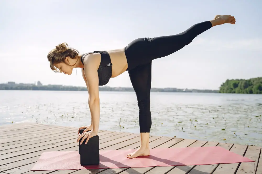 A woman practicing yoga.