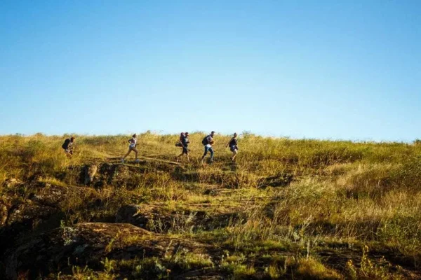 Group of hikers crossing rocky terrain